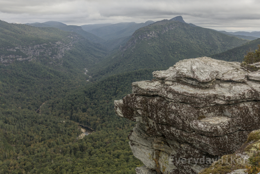 Looking towards Hawksbill Mountain, with a rocky outcrop nearby.  Linville river may be seen cutting its way through Linville Gorge.