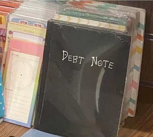 Picture of a book that looks like the "Death Note" from the manga of the same name, but reads "Debt Note" on the cover